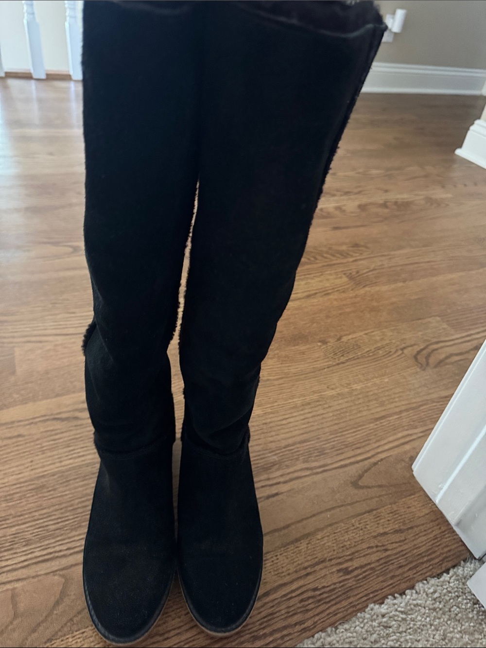 UGG tall boots . Suede with black shearling inside. Size 7